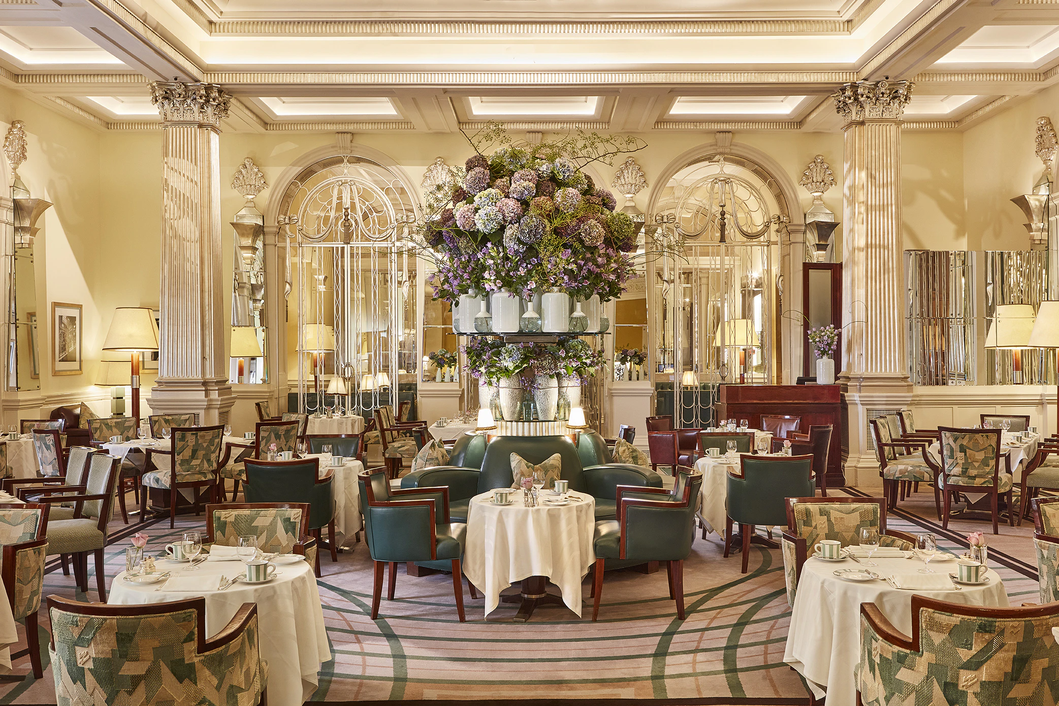 Morning light in Claridge's Foyer and Reading Room, tables set for breakfast.
