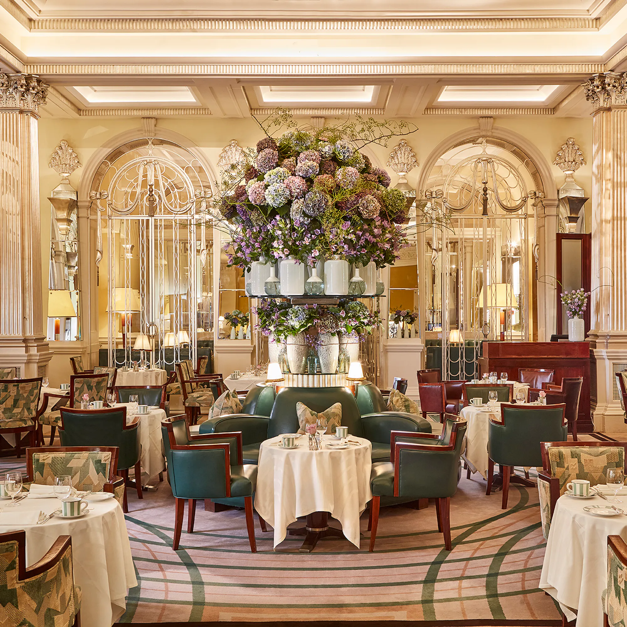 Morning light in Claridge's Foyer and Reading Room, tables set for breakfast.