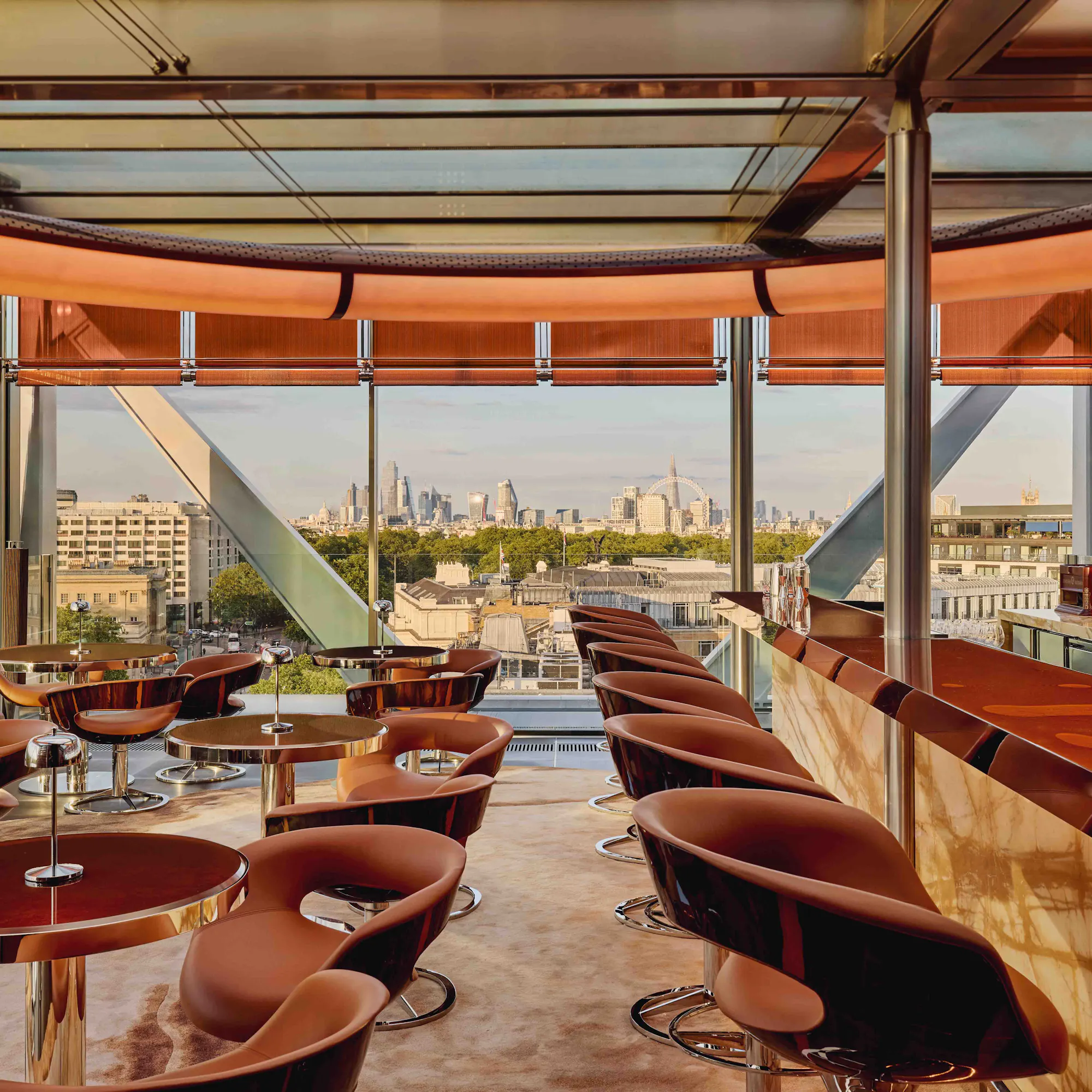 The City of London and London Eye from The Emory's Rooftop Bar at twilight.