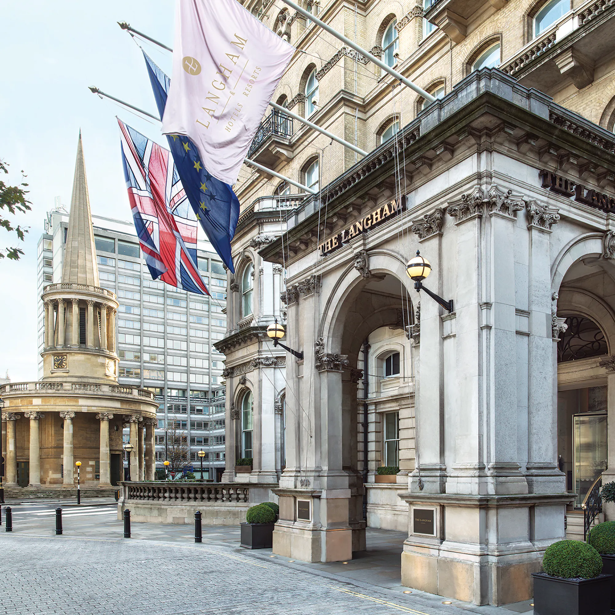 Entrance of The Langham in London with All Souls Church, Langham Place in the background.