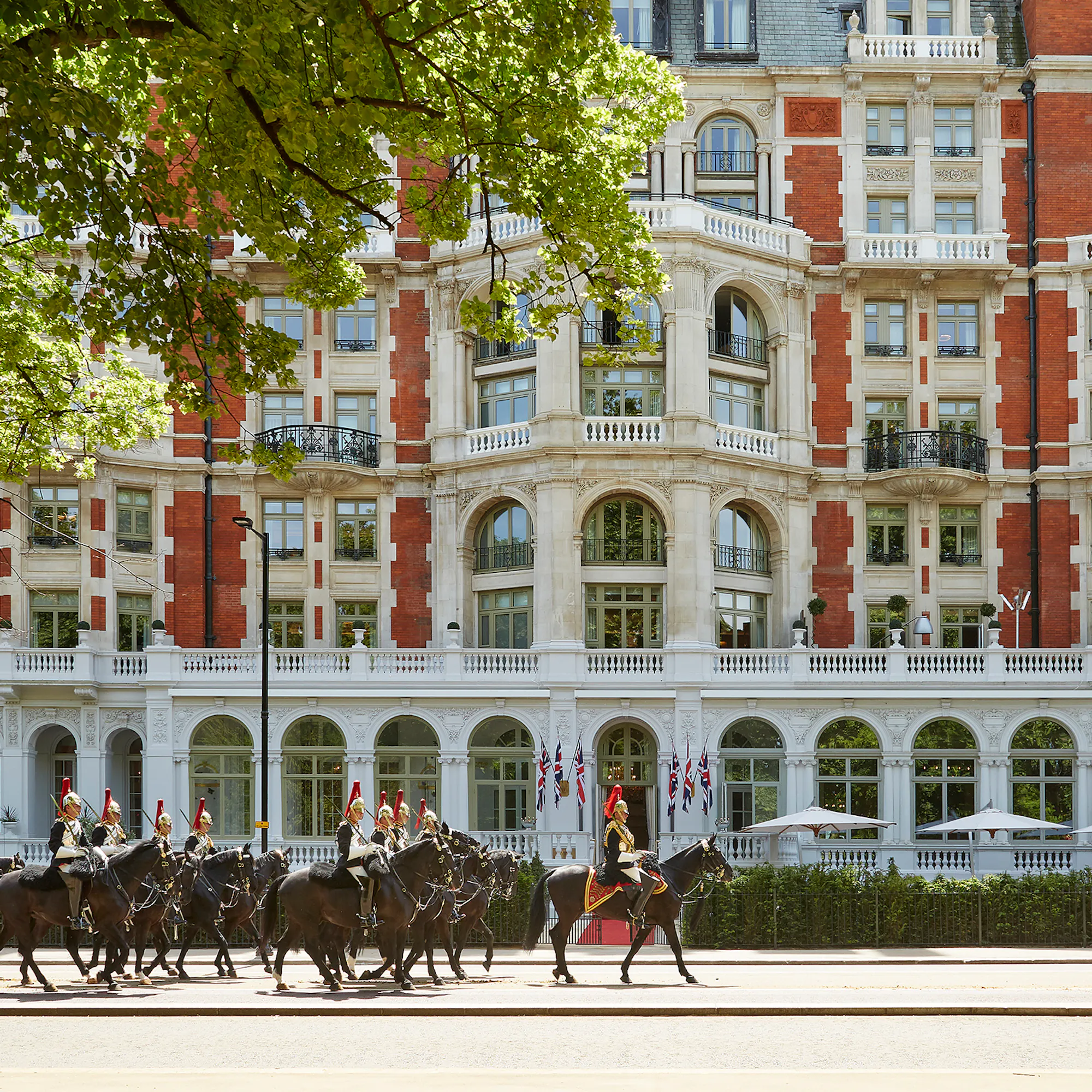 Mandarin Oriental Hyde Park, with the Household Cavalry parading past its entrance.