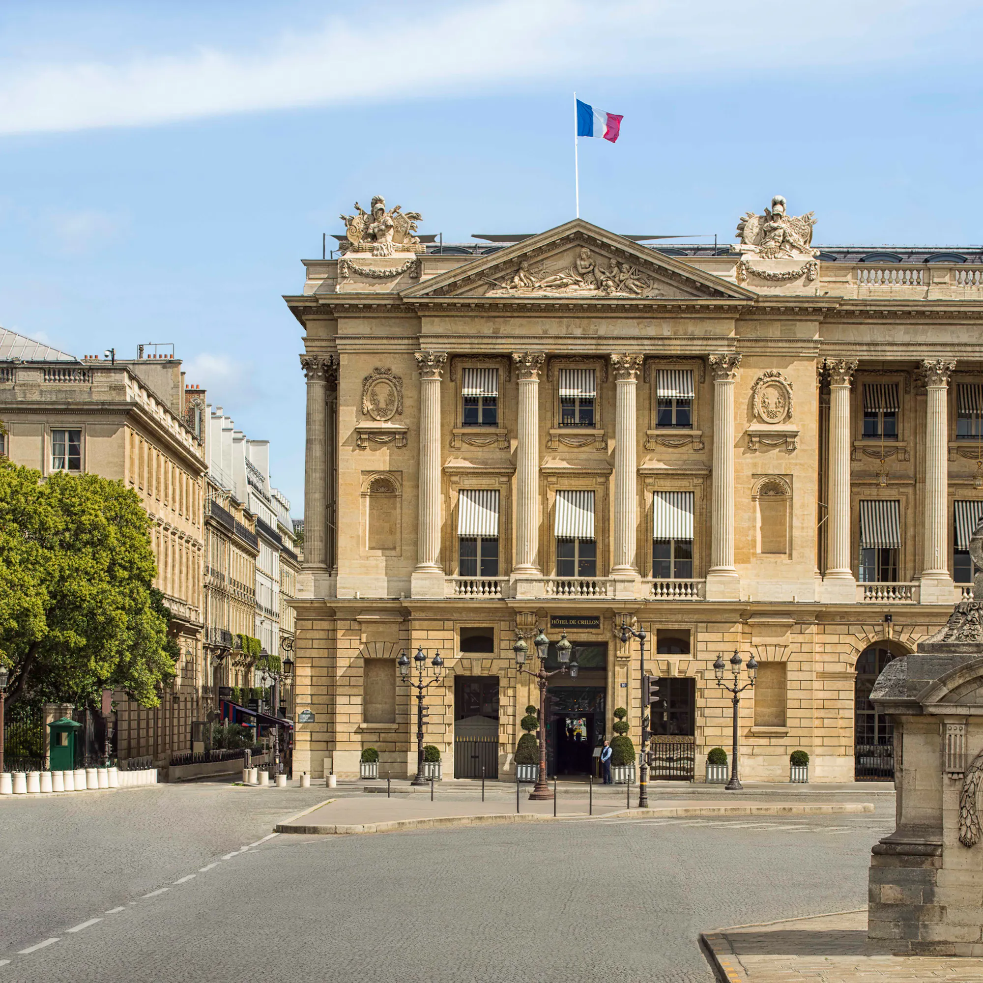 Hôtel de Crillon, A Rosewood Hotel, seen behind the Statue de Rouen on Place de la Concorde.