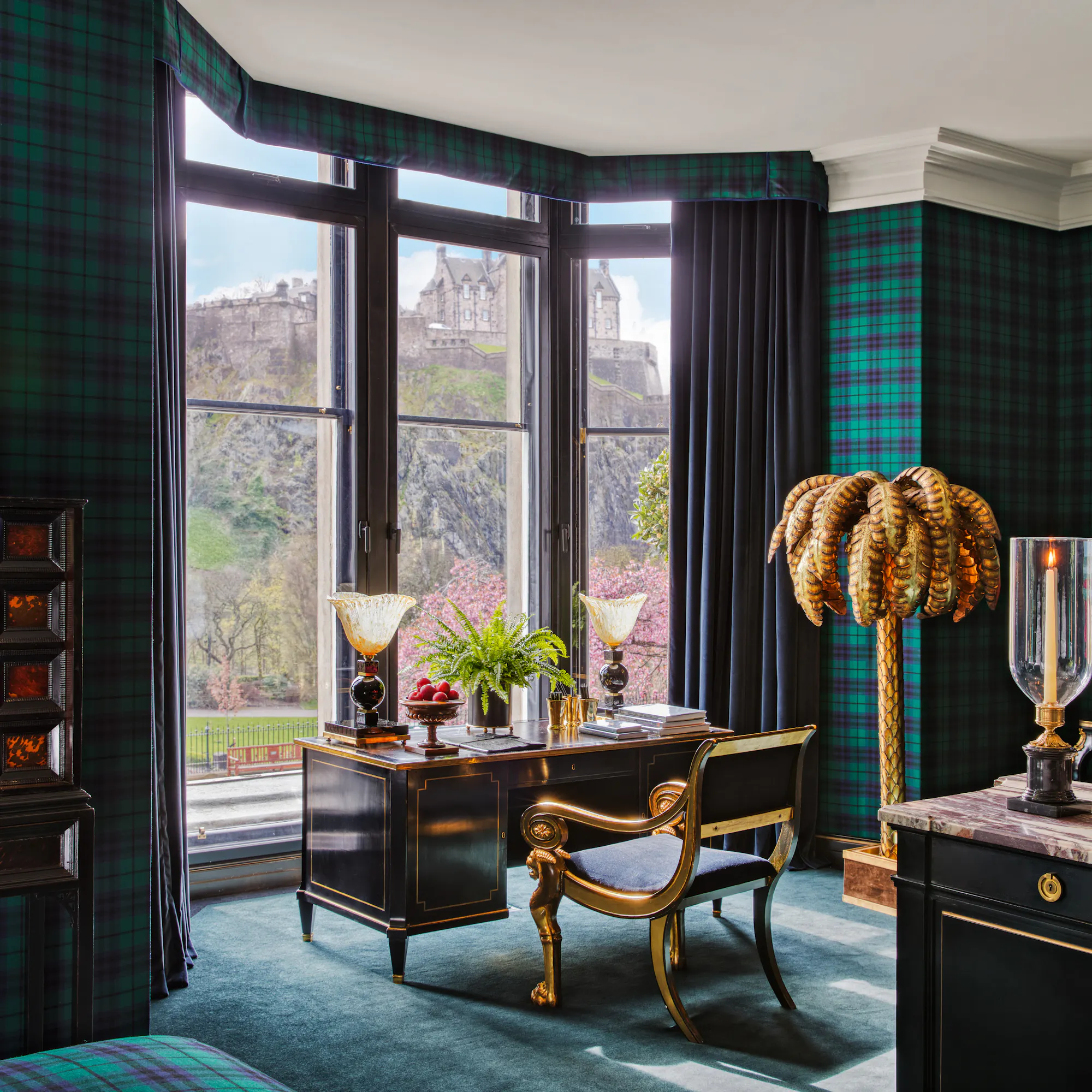 Edinburgh Castle framed in the bay window of a tartan suite at 100 Princes Street hotel.